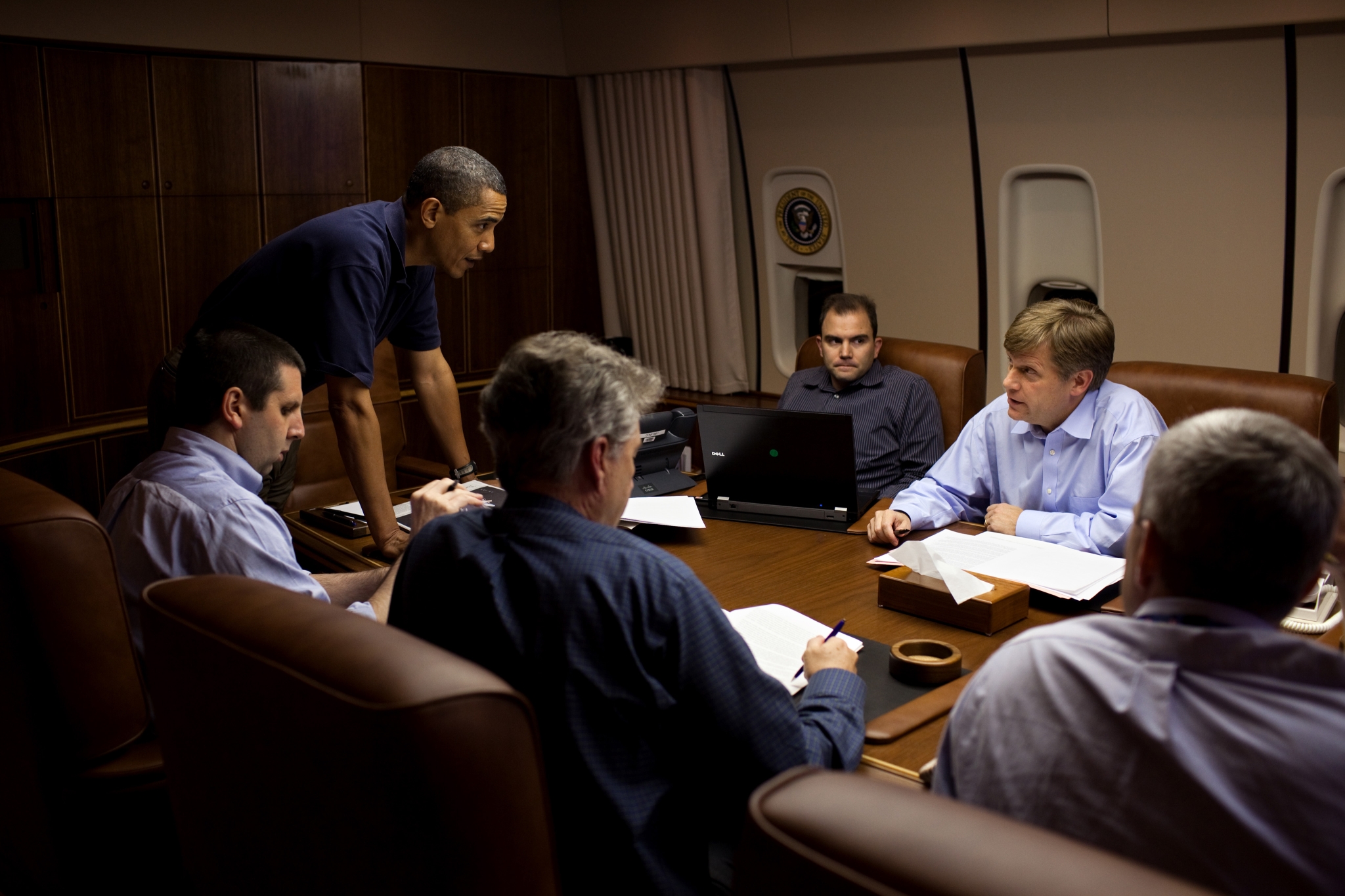 President Barack Obama is briefed by, from left, NSC Chief of Staff Mark Lippert, Former U.S. Ambassador to Russia William J. Burns, Deputy National Security Advisor for Strategic Communications Ben Rhodes, NSC Senior Director for Russian Affairs Mike McFaul, and Deputy National Security Advisor for Strategic Communications Denis McDonough, in the Conference Room aboard Air Force One, during a flight to Moscow, Russia, July 5, 2009. (Official White House Photo by Pete Souza)