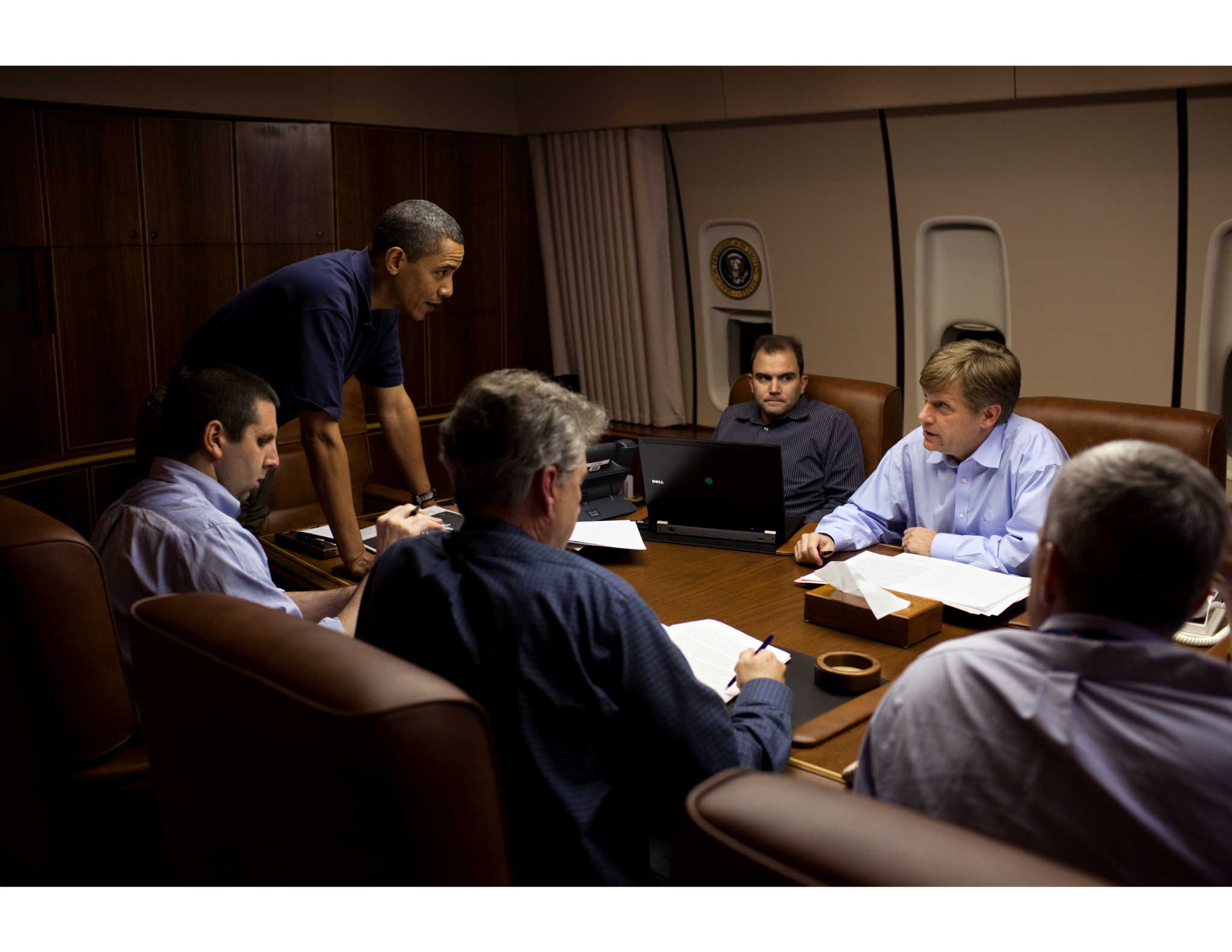 President Barack Obama is briefed by, from left, NSC Chief of Staff Mark Lippert, Former U.S. Ambassador to Russia William J. Burns, Deputy National Security Advisor for Strategic Communications Ben Rhodes, NSC Senior Director for Russian Affairs Mike McFaul, and Deputy National Security Advisor for Strategic Communications Denis McDonough, in the Conference Room aboard Air Force One, during a flight to Moscow, Russia, July 5, 2009. (Official White House Photo by Pete Souza)